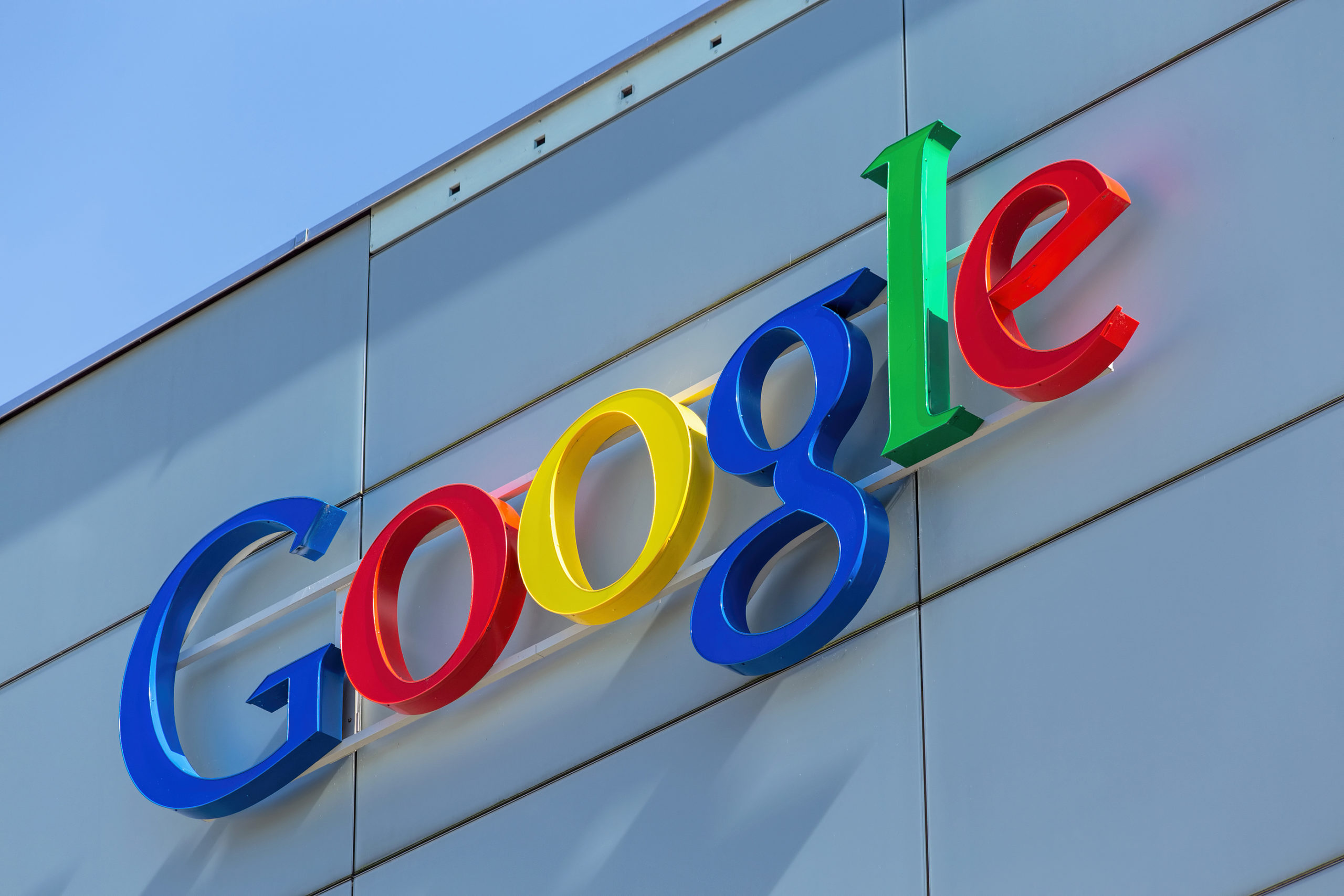 Zurich, Switzerland - 24 June, 2015: Google sign on the wall of the Google office building. Google is a multinational technology company specializing in Internet-related services and products.